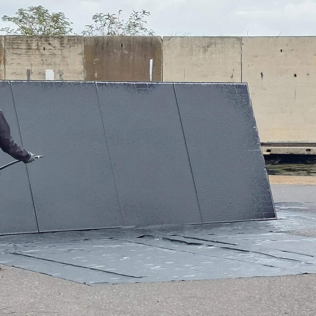 PVSTOP being sprayed on a solar panel in a commercial setting